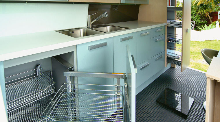 A view of a kitchen by the Mobile countertop, kitchen, white