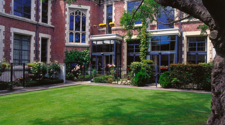 A view of the Peterborough Apartments,  architect architecture, backyard, building, cottage, courtyard, estate, facade, garden, grass, historic house, home, house, landscaping, lawn, mansion, neighbourhood, plant, plantation, property, real estate, residential area, tree, window, yard, green