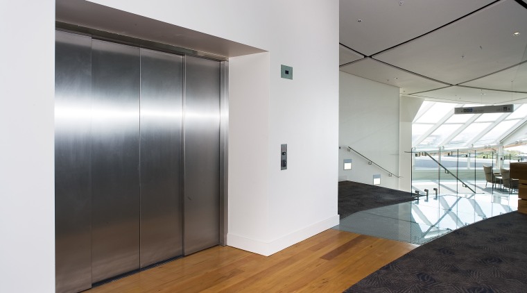 A view of an elevator supplied by Otis architecture, ceiling, door, floor, glass, house, interior design, real estate, white, gray