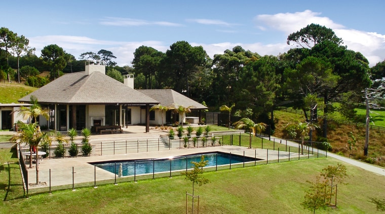 View of this outdoor pavillion that has a backyard, cottage, estate, home, house, leisure, property, real estate, residential area, resort, swimming pool, villa, brown, teal