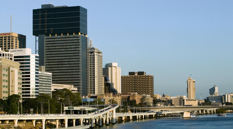 View of the 40 storey brisbane square building bridge, building, city, cityscape, condominium, daytime, downtown, metropolis, metropolitan area, real estate, reflection, river, sky, skyline, skyscraper, tower block, urban area, water, teal