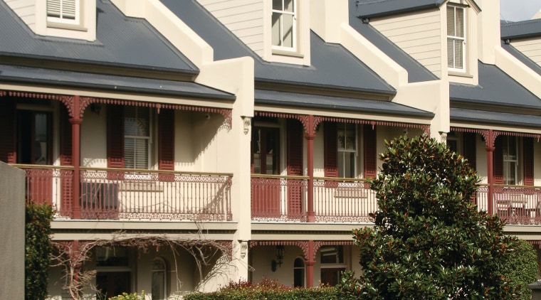 An exterior view of the domain terraces - architecture, building, cottage, estate, facade, historic house, home, house, mansion, neighbourhood, outdoor structure, property, real estate, residential area, roof, siding, suburb, tree, window, white