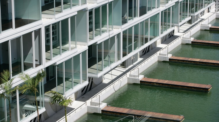 An exterior view of the lighter quay apartment architecture, building, condominium, facade, mixed use, water, gray