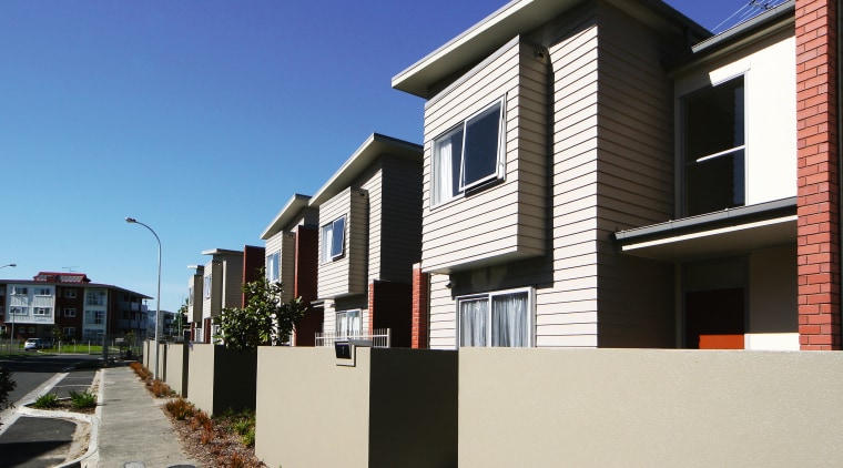 An exterior view of this new residential complex apartment, architecture, building, condominium, elevation, facade, home, house, neighbourhood, property, real estate, residential area, siding, suburb, window, white, black