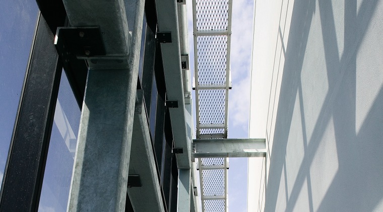 A view of the structural steel manufactured and architecture, building, daylighting, daytime, facade, glass, line, steel, structure, window, gray, black, white