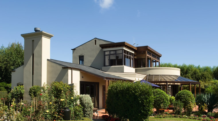 This home, designed by architect Colin Duckett of cottage, elevation, estate, facade, farmhouse, home, house, landscape, landscaping, mansion, property, real estate, residential area, roof, siding, villa, teal