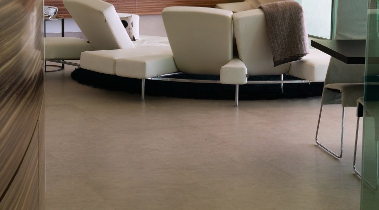 A view of this apartment featuring zMonaco Brown floor, flooring, furniture, hardwood, interior design, laminate flooring, living room, table, tile, wood, wood flooring, brown, gray