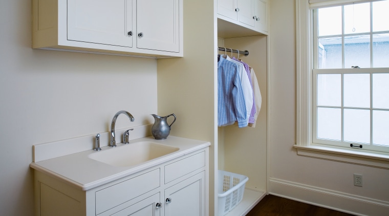 A view of this laundry featuring white timber bathroom, bathroom accessory, bathroom cabinet, cabinetry, countertop, floor, home, interior design, kitchen, laundry room, real estate, room, sink, wall, window, wood, gray