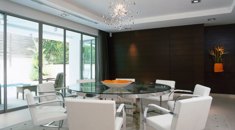 A view of the dining room feature teak ceiling, dining room, interior design, living room, real estate, table, gray