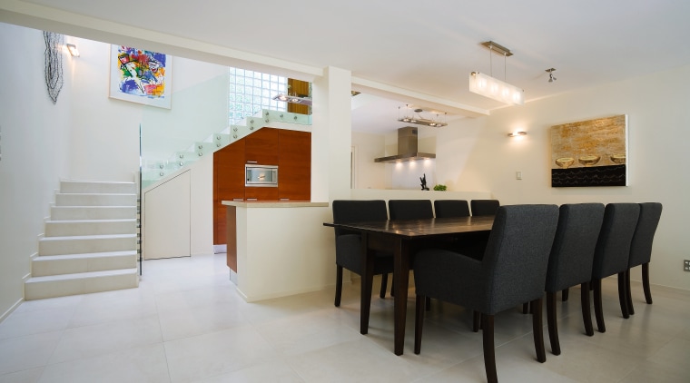 In this homes living space, clsaaical finishes and apartment, architecture, ceiling, dining room, floor, flooring, house, interior design, property, real estate, room, table, gray