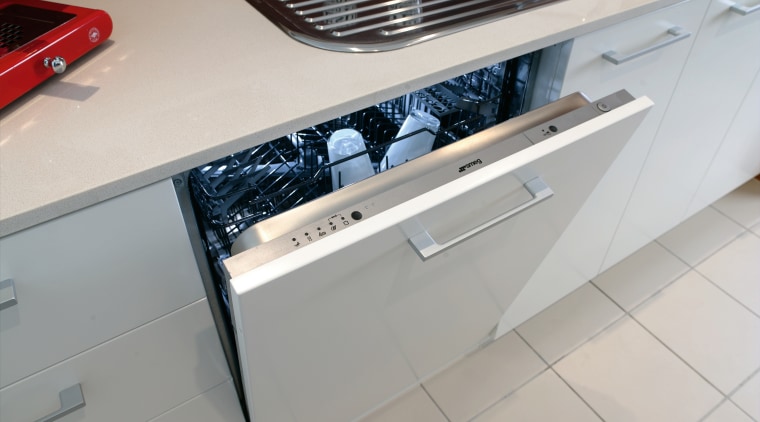 The intergrated dishwasher helps to give the kitchen automotive exterior, countertop, floor, home appliance, kitchen, kitchen stove, major appliance, gray