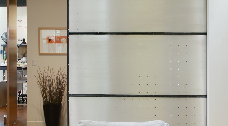 An interior view of the living area featuring ceiling, floor, furniture, interior design, living room, room, wall, window, gray