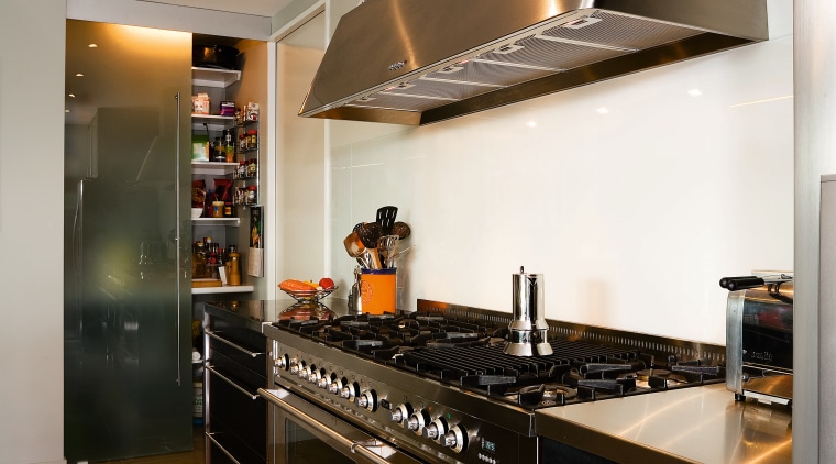 A veiw of this kitchen featuring stainless steel cabinetry, countertop, cuisine classique, home appliance, interior design, kitchen, room, gray, brown