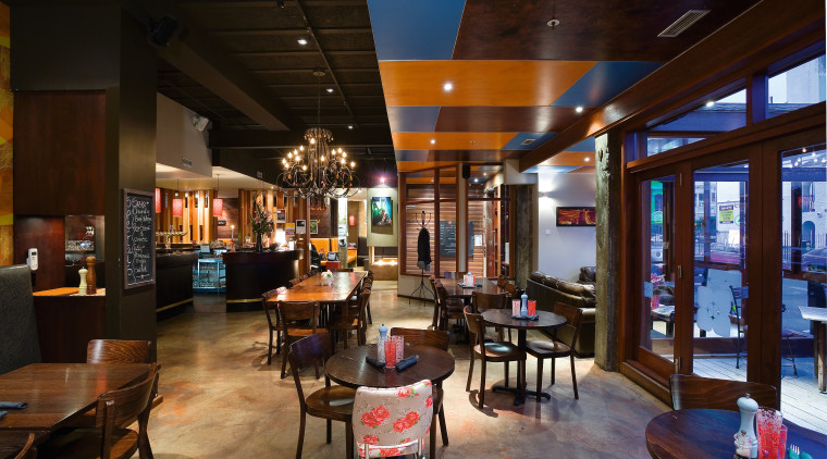 Like much of the interior, the hand-painted concrete café, interior design, restaurant, black, brown