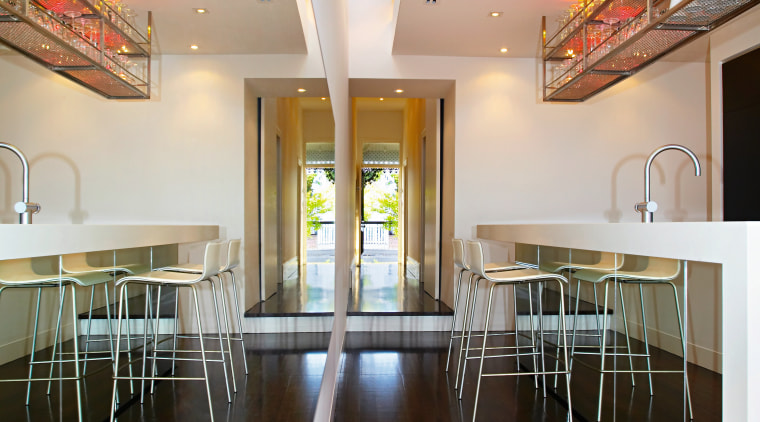 Recycled materials were used extensivley throughtout the home.The ceiling, daylighting, floor, flooring, house, interior design, table, wood, black, gray