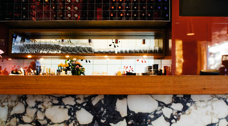 Shades of red add warmth, while chrome and furniture, interior design, lighting, restaurant, table, black, gray