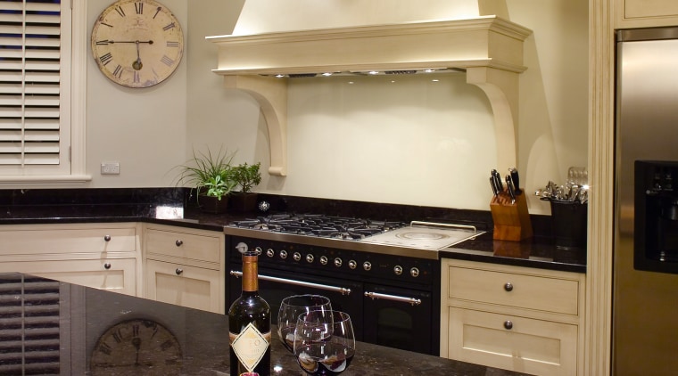 A view of this traditional kitchen featuring antique countertop, interior design, kitchen, living room, room, orange, black