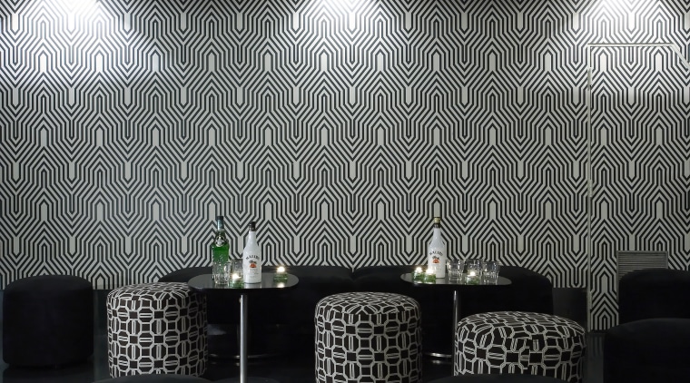 Geometric print wallpaper and fabric covering for the architecture, ceiling, daylighting, interior design, light, light fixture, lighting, product design, table, wall, gray, black