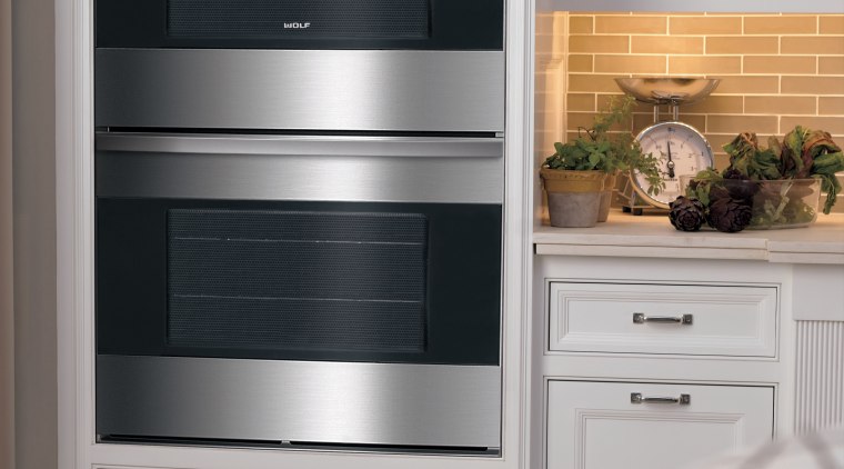 The latest E Line range is displayed in gas stove, home appliance, kitchen, kitchen appliance, kitchen stove, major appliance, microwave oven, oven, refrigerator, gray