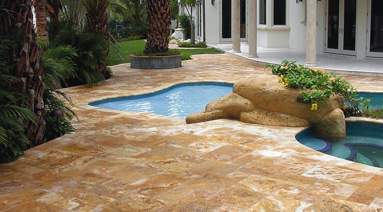 A view of Marble and travetine pavers with backyard, driveway, estate, flagstone, floor, flooring, home, landscape, landscaping, outdoor structure, patio, real estate, walkway, brown, orange