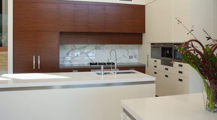 The island in this kitchen have benchtops of cabinetry, countertop, interior design, kitchen, gray