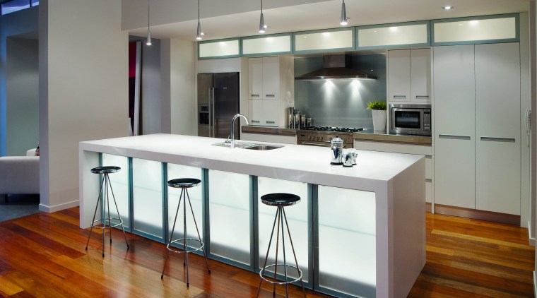 A view of this kitchen featuring polished timber cabinetry, countertop, cuisine classique, interior design, kitchen, real estate, gray