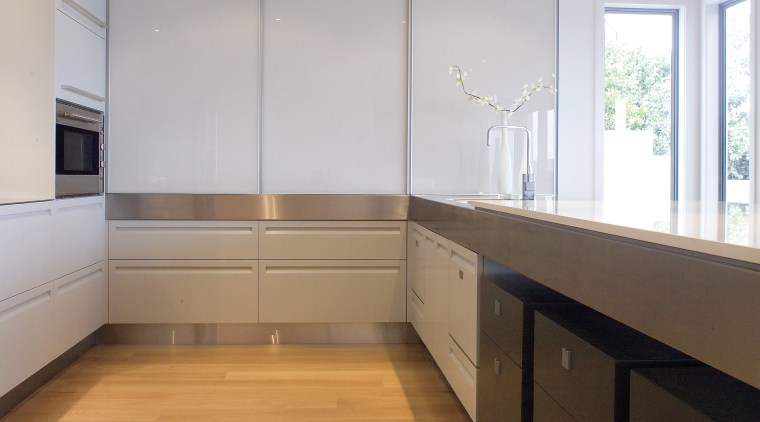 A view of this Kitchen designed by Fyfe cabinetry, ceiling, countertop, daylighting, floor, flooring, hardwood, interior design, kitchen, laminate flooring, property, real estate, room, wood, wood flooring, gray
