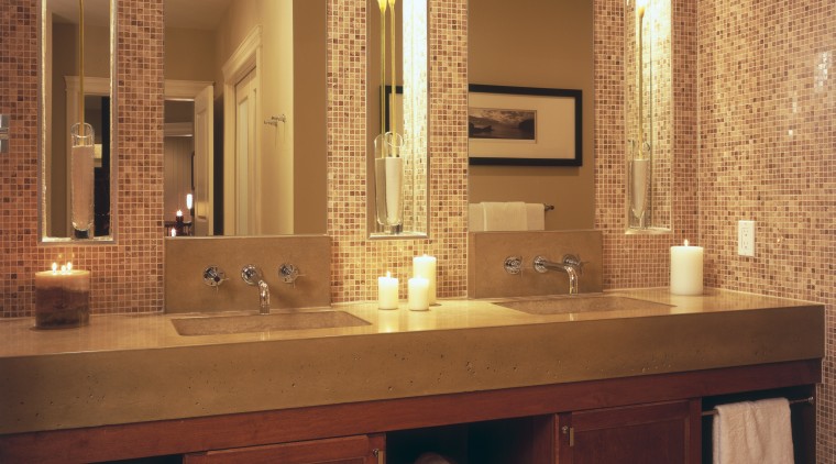 A view of the maser bathroom featuring tiled bathroom, bathroom accessory, bathroom cabinet, cabinetry, flooring, furniture, interior design, room, sink, wall, orange, brown