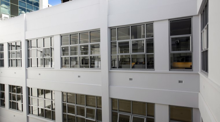Blinds help to control light from the central architecture, building, facade, window, gray