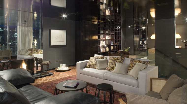 An interior view of this apartment living area home, interior design, lighting, living room, lobby, property, room, black
