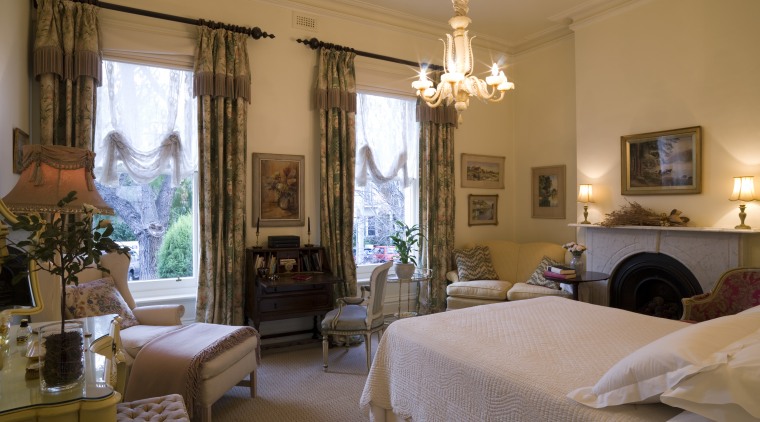 The writing bureau in the bedroom is emblematic bed, bedroom, ceiling, estate, furniture, home, interior design, living room, property, real estate, room, suite, window, window treatment, brown