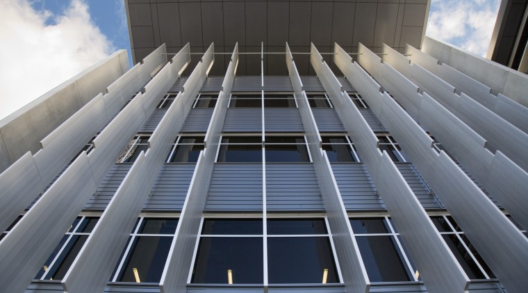 A view of the exterior of the greensquare architecture, building, commercial building, condominium, corporate headquarters, daylighting, daytime, facade, headquarters, landmark, line, metropolis, metropolitan area, sky, skyscraper, structure, symmetry, tower block, urban area, gray