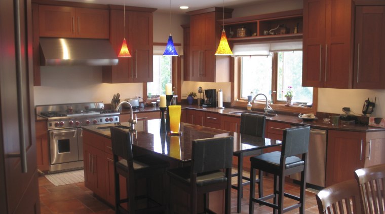 A view of this kitchen featuring a granite countertop, interior design, kitchen, room, table, red