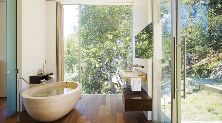 A view of the bathroom featuring oval limestone architecture, bathroom, estate, floor, home, house, interior design, property, real estate, room, window, white