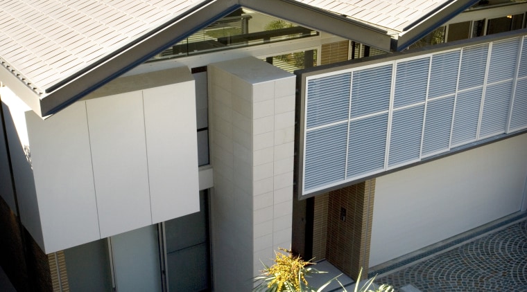 This house uses bricks and roofing tiles to architecture, building, cottage, daylighting, facade, home, house, property, real estate, residential area, roof, window, white