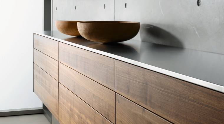 A view of this kitchen featuring Sleek contemporary chest of drawers, drawer, floor, furniture, interior design, plywood, product design, sideboard, wall, wood, wood stain, white