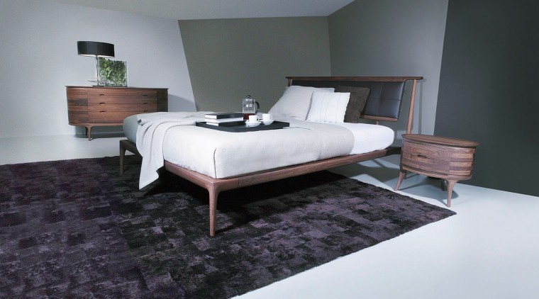 A view of some furniture from Domus Design. bed, bed frame, bedroom, floor, flooring, furniture, interior design, mattress, room, suite, wood, black, gray, white