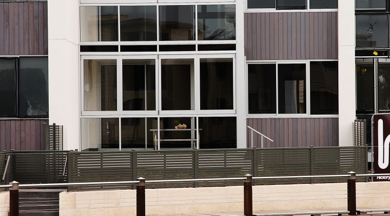 Exterio view of the Martha Cove apartments that apartment, architecture, building, condominium, facade, house, real estate, reflection, residential area, water, waterway, window, black, white