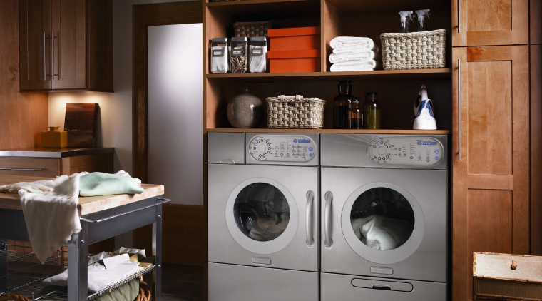 A view of this niche built in laundry cabinetry, clothes dryer, furniture, home appliance, laundry, laundry room, major appliance, room, washing machine, black, gray