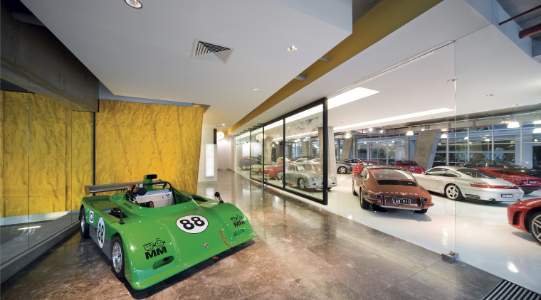 Movement is suggested by the rippled yellow panels automotive design, car, car dealership, house, interior design, motor vehicle, property, gray