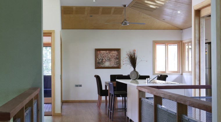 Hallway leading to dining area inside sustainable home architecture, ceiling, daylighting, floor, flooring, hardwood, home, house, interior design, kitchen, laminate flooring, living room, real estate, room, wood, wood flooring, gray