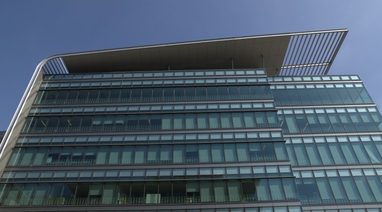 Taylor Thomson Whitting was commissioned to refine and architecture, brutalist architecture, building, commercial building, condominium, corporate headquarters, daylighting, daytime, facade, headquarters, landmark, metropolis, metropolitan area, mixed use, sky, skyscraper, structure, tower block, teal, black