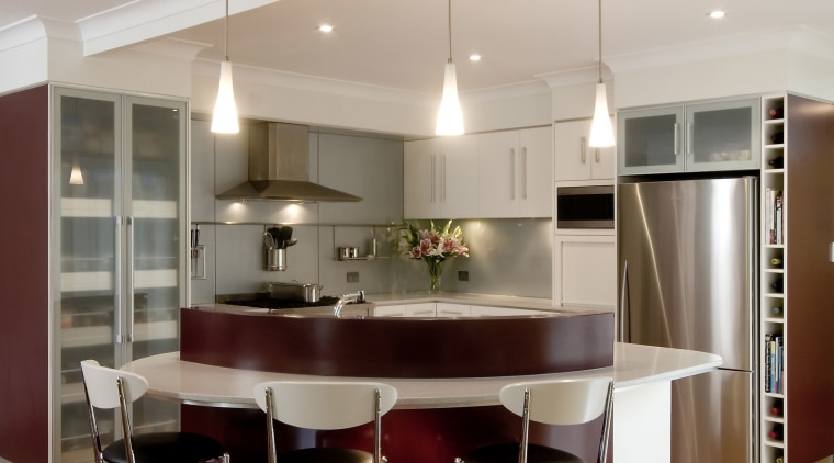 A view of a kitchen deigned by KBDI. ceiling, countertop, dining room, floor, flooring, furniture, interior design, kitchen, real estate, room, table, gray