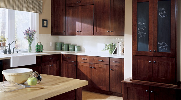 view of kitchen featuring wooden flooring, countertops, cabinetry, cabinetry, countertop, cuisine classique, furniture, hardwood, interior design, kitchen, room, wood, red