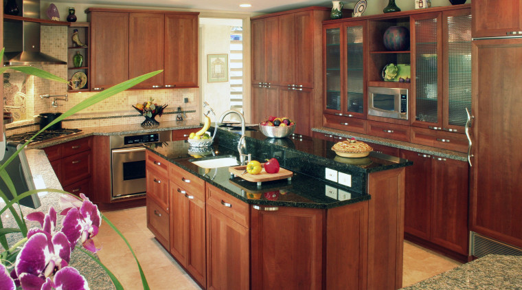 view of kitchen by Dream Kitchens, featuring cabinetry, cabinetry, countertop, cuisine classique, interior design, kitchen, room, orange