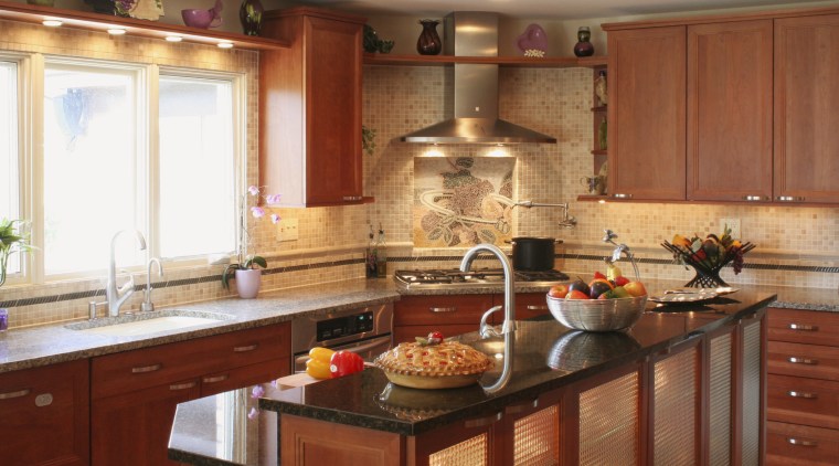view of kitchen by Dream Kitchens, featuring cabinetry, cabinetry, countertop, cuisine classique, flooring, interior design, kitchen, room, brown