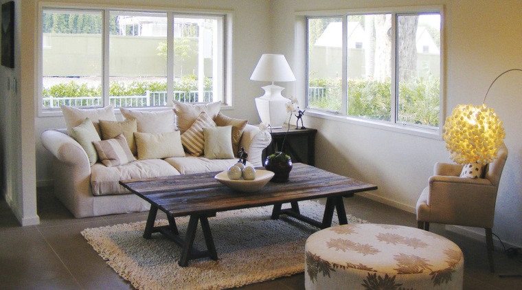 Walls and floors are highly insulated in all coffee table, couch, floor, flooring, furniture, home, interior design, living room, real estate, room, table, window, window covering, window treatment, gray, brown