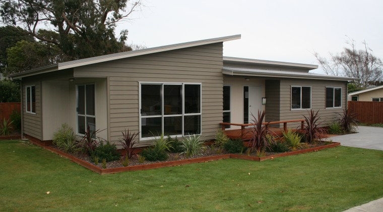 A1 Homes Beach Series house designed for coastal backyard, cottage, facade, farmhouse, grass, home, house, landscape, neighbourhood, property, real estate, residential area, roof, siding, window, yard, brown