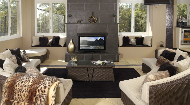 With the LCD television, the image colour and floor, furniture, hearth, home, interior design, living room, room, black