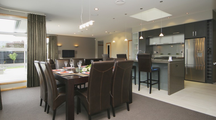 Dining area inside home designed and built by dining room, flooring, interior design, kitchen, real estate, room, table, gray, black